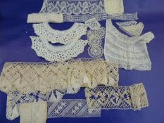 Quantity of lace , crocheted, trimmings collars, a lace fichu etc.