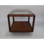 A mid-century G Plan teak square coffee table with inset glass top, on casters (54cm wide x 46cm
