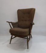 Ercol cottage style open armchair with brown upholstered back and seat