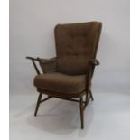 Ercol cottage style open armchair with brown upholstered back and seat