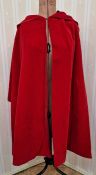 1960's red velvet evening cloak labelled Raymond of London with black satin lining and hood with