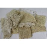 Assorted lace and crocheted pieces to include collars, trimmings, a small shawl, a lace circular