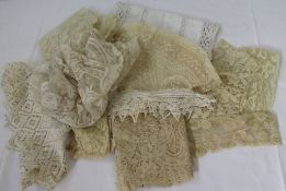 Assorted lace and crocheted pieces to include collars, trimmings, a small shawl, a lace circular