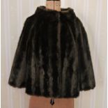 Faux fur short coat and an Alpaca full-length coat labelled Pacabella, guaranteed 100% pure alpaca