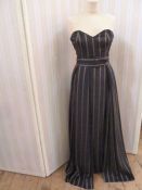 Chris Clyne Collection Black silk strapless fitted evening gown, with belted overskirt , boned