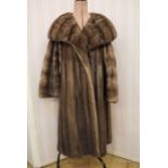 Vintage mink coat with a deep shawl collar, bell bracelet sleeves, patterned liningCondition