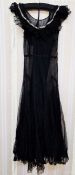 1920's black net and lace full-length evening dress trimmed with later sequins around the neck,