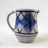 Alan Caiger-Smith blue and white pottery jug with zigzag decoration, monogram to base (12 cm tall)