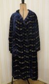 1920's cut-velvet and lame midnight blue evening coat, the lining shot-satin in yellow and