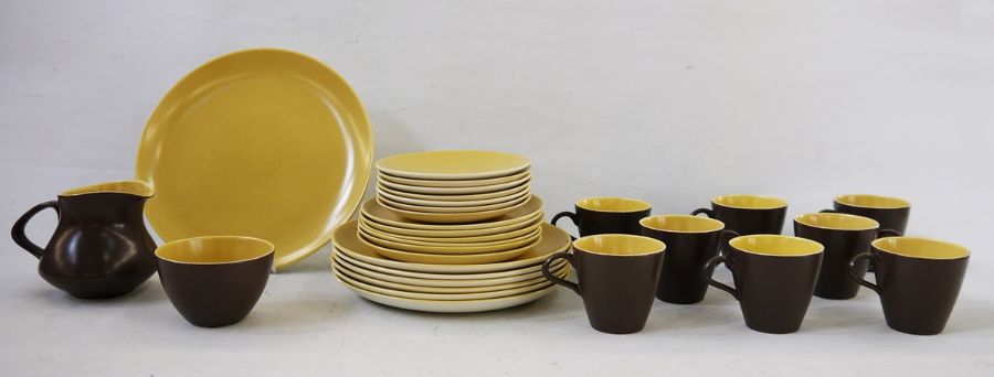 Set of Poole Pottery twintone brown and yellow range tableware including amount of 8 cups, 7