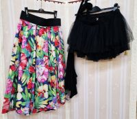 Short net mini skirt, a black halter-neck top with paste decoration to the bodice and a