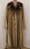 Vintage mink coat with deep shawl collar, button detail to the bell sleeves, double-breasted