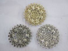 Three large Butler & Wilson circular floral diamante brooches, one in shades of white, one in shades