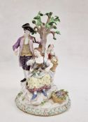 19th century Meissen porcelain figure group of family picking fruit and flowers beside tree, the man