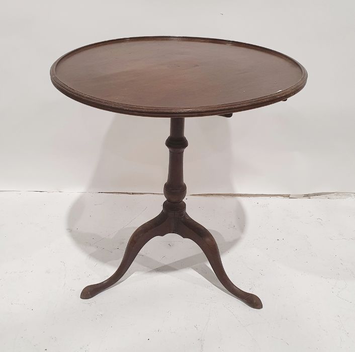 Georgian mahogany tripod table, the circular dished top on turned pedestal to tripod base