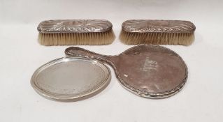 Silver-backed dressing table brushes and mirror and a weighted Georgian silver oval tray (4)