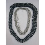 Appartement a Louer teal, plastic and white metal link graduated necklace and strings of simulated