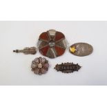 Scottish-style hardstone and agate shaped circular brooch, silver violin brooch, two others and