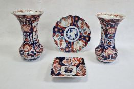 Japanese Imari wares to include two flared vases, onion-shaped vase, square dish and lobed dish (5)