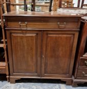Early 20th century mahogany cupboard, the rectangular top with moulded edge above single drawer, two