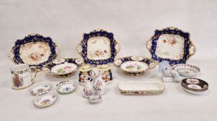 Two 19th century china comports hand-painted with flowers to royal blue ground, gilt and yellow