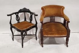 Late Victorian armchair with yellow upholstered back and seat, on front legs to brown china
