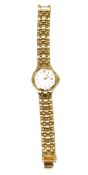 Lady's Citizen yellow metal wristwatch with baton numerals and date aperture.  Flexible mesh strap