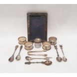 Five assorted silver napkin rings and sugar tongs, foreign white metal teaspoons, silver picture