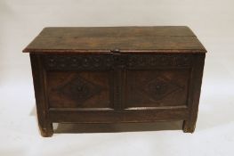 Possibly 17th century and later oak coffer, the rectangular top with moulded edge, diamond carved
