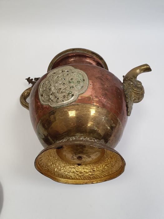Late 19th century or later, Tibetan copper and brass fitted teapot, with Naga form handle. - Image 27 of 33