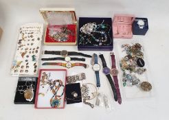 Several earrings, brooches, charm bracelets, ammonite pendant, various watches and some silver etc.