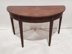 19th century mahogany demi-lune table on square section tapering supports, 120cm x 71cm