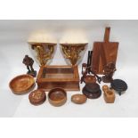 Box of wooden items to include chopping board, wall mounts, bowl, figure of man and woman, box