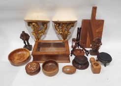 Box of wooden items to include chopping board, wall mounts, bowl, figure of man and woman, box