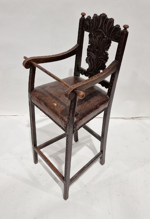 Antique oak child's high chair with foliate carved top rail and backsplat, brown leather seat - Image 2 of 2