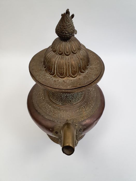 Late 19th century or later, Tibetan copper and brass fitted teapot, with Naga form handle. - Image 13 of 33