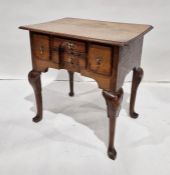 Early Georgian oak lowboy, the rectangular top with shaped corners and moulded edge, above four
