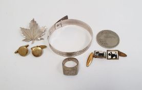 Adjustable bangle marked sterling silver, brooch in the form a maple leaf marked sterling, 1943