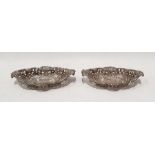 Pair of Edward VII silver trinket dishes, oval shaped with pierced sides and flower decorated. (