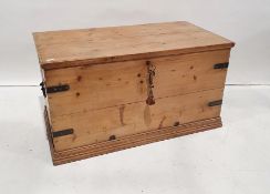 20th century pine trunk with iron bandings, on plinth base, 109cm x 59.5cm