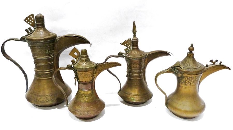Four 19th century or later, Yemeni/Islamic copper Dallah coffee pots, one with dotted brass decorati