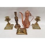 Two brass candlesticks with foliate decoration, on square bases, a brass purse with hinged lid and