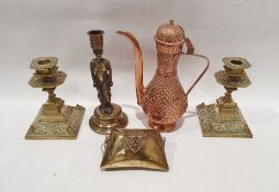 Two brass candlesticks with foliate decoration, on square bases, a brass purse with hinged lid and