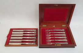 Victorian silver knife and fork set in mahogany canteen, the handles with embossed grape and vine