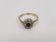 9ct gold, blue/black and white stone cluster ring, the centre blue/black stone with surround of
