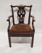 Georgian-style mahogany armchair with carved and shaped Chippendale-style backsplat, shaped arm