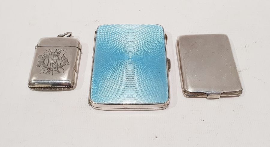 Silver and enamel cigarette case with gilt washed interior, a silver vesta case and one further