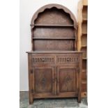 20th century oak dresser, the arched top above two shelves, on base of two drawers and two