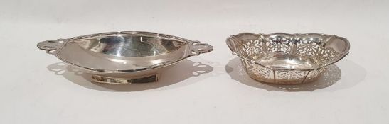 Silver trinket dish, oval and panelled with geometric tab handles, Birmingham 1933 and a silver dish