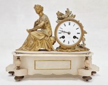 Gilt metal and alabaster clock with drum face and figure to the left on neoclassical style base with